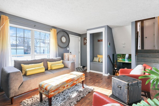 living room with hardwood / wood-style flooring and a textured ceiling