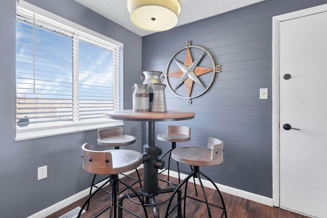 dining area featuring dark hardwood / wood-style floors