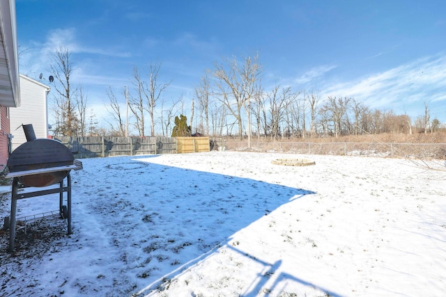 view of yard layered in snow