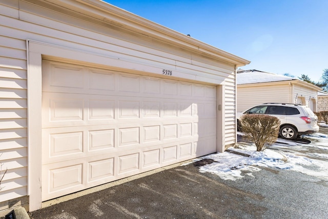 view of snow covered garage