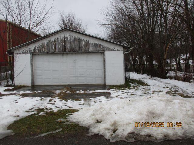 view of snow covered garage