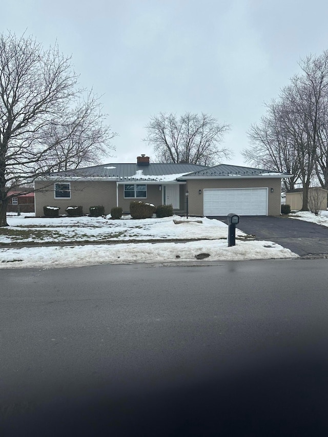 ranch-style home with a garage