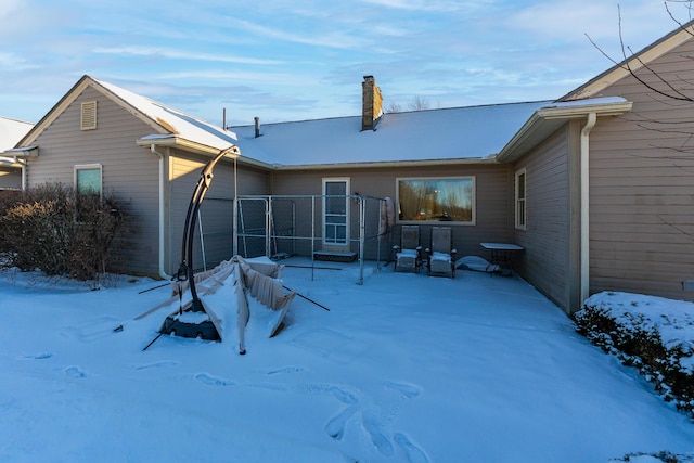 view of snow covered property