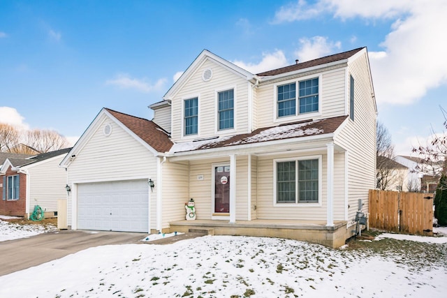 front of property featuring a garage and a porch