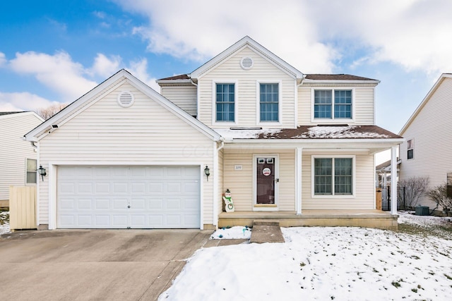 front of property with a porch and a garage