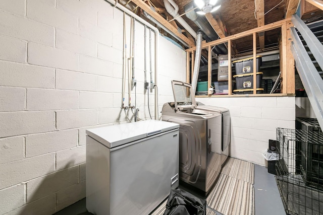 laundry area with separate washer and dryer