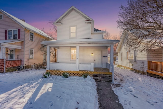 view of property featuring covered porch