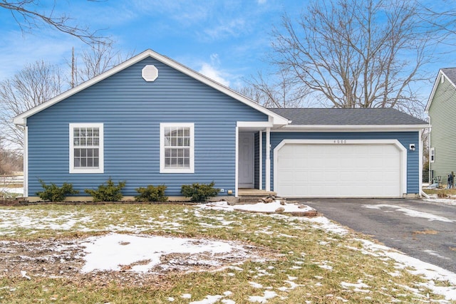 single story home featuring a garage