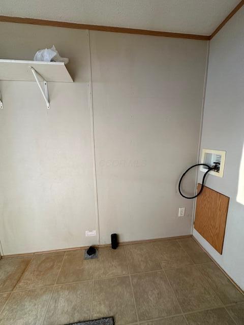 washroom with washer hookup and ornamental molding