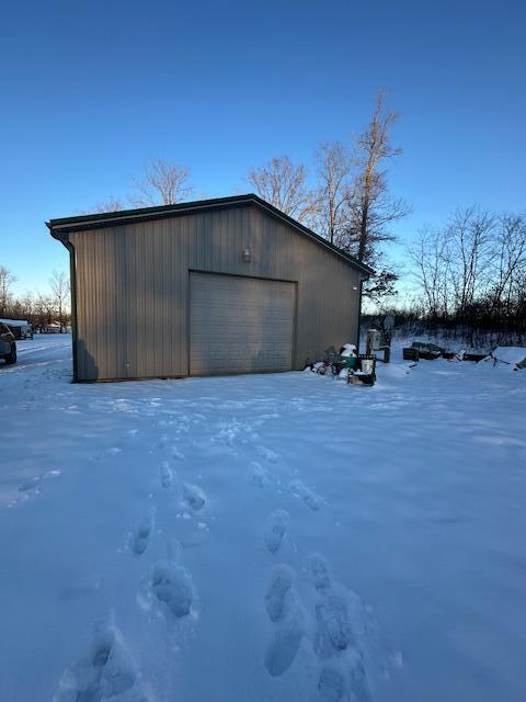 view of snow covered garage