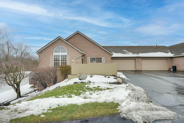 ranch-style house featuring a garage