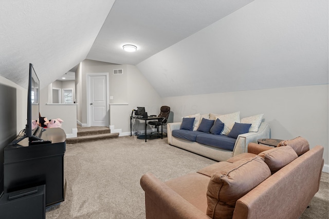 carpeted living room featuring lofted ceiling