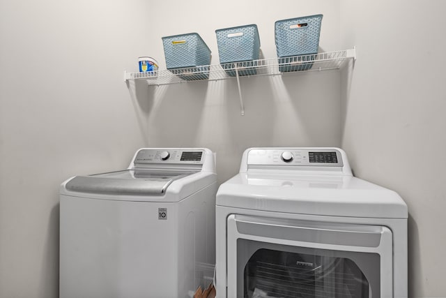 washroom with washer and clothes dryer