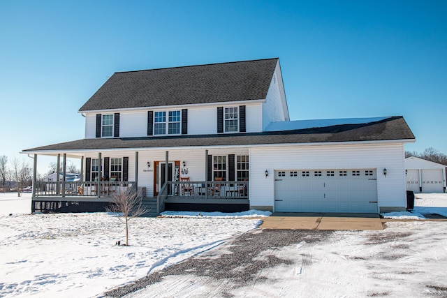 view of front of property with a porch and a garage