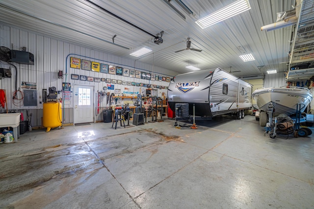 garage featuring a workshop area and electric panel