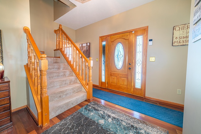 entryway with dark wood-type flooring