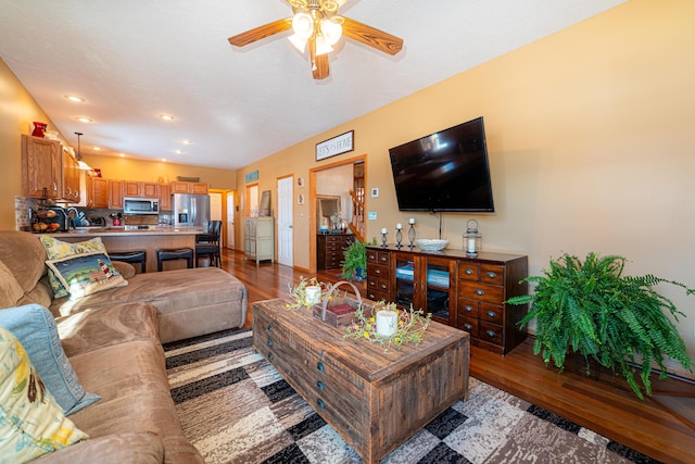 living room featuring ceiling fan and light hardwood / wood-style floors