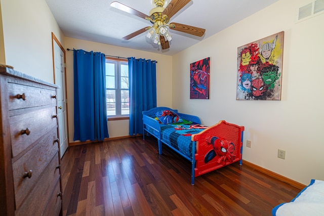 bedroom with ceiling fan and dark hardwood / wood-style floors