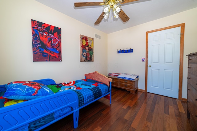 bedroom featuring dark hardwood / wood-style floors and ceiling fan