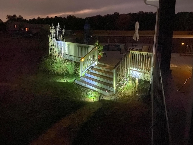 yard at dusk with a wooden deck