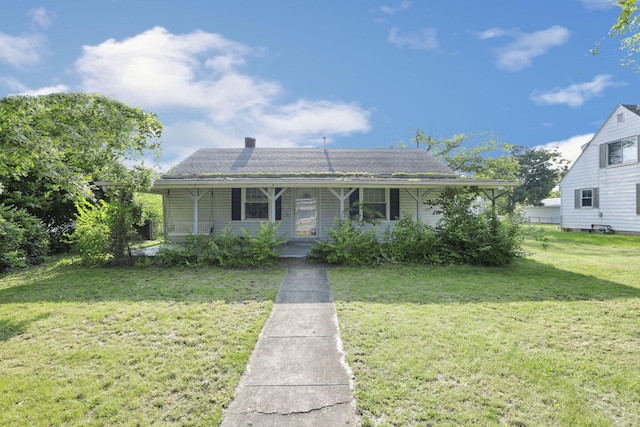 10 Main St, Orient, OH 43146 - bungalow featuring covered porch, a front yard, and a chimney