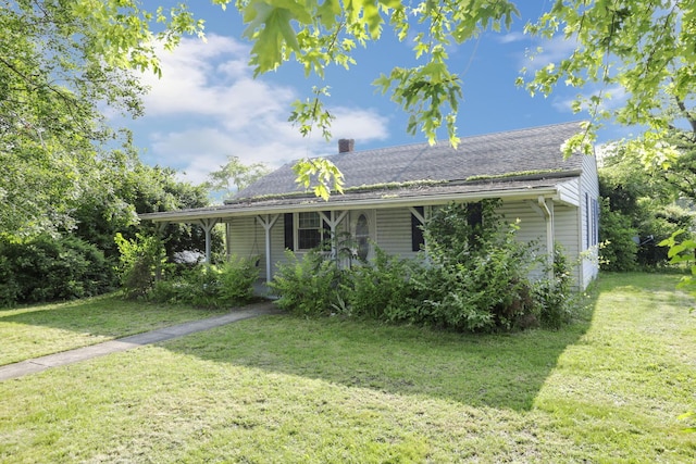 10 Main St, Orient, OH 43146 - view of front of house featuring a chimney, a front lawn, and a shingled roof