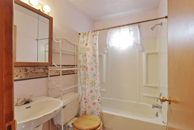 10 Main St, Orient, OH 43146 - bathroom with toilet, shower / bath combination with curtain, and a sink