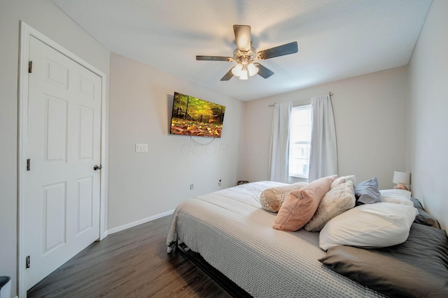 bedroom featuring ceiling fan and dark hardwood / wood-style flooring