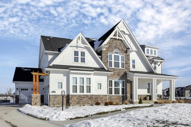 view of front facade featuring a garage and a porch