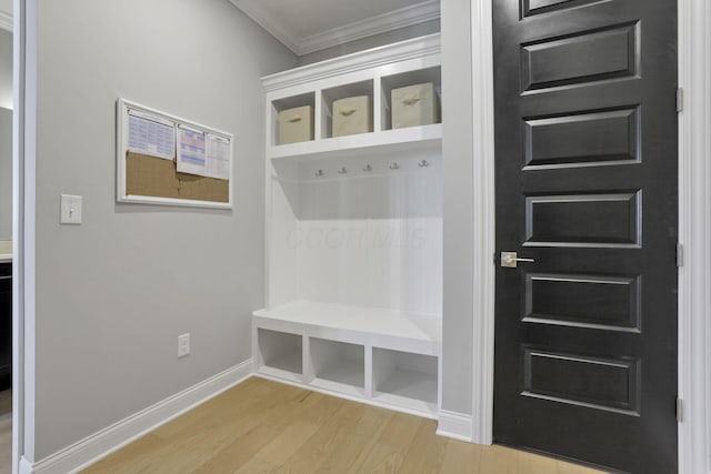 mudroom featuring ornamental molding and hardwood / wood-style floors