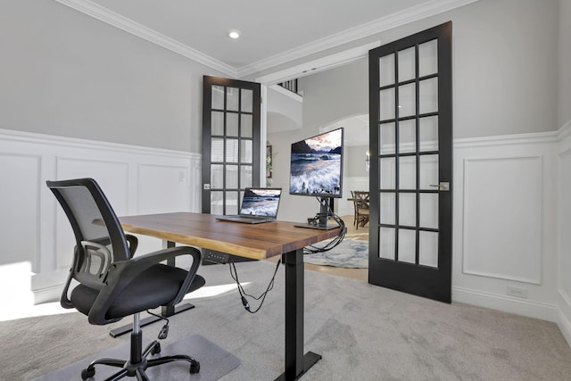 home office with crown molding, light colored carpet, and french doors