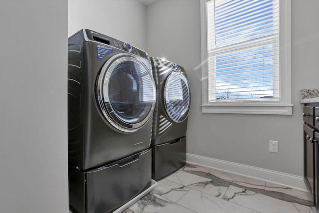 laundry room featuring washing machine and dryer