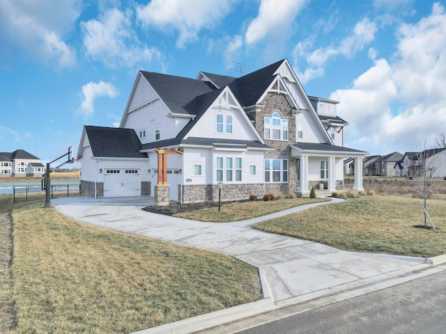 view of front of home featuring a garage and a front lawn