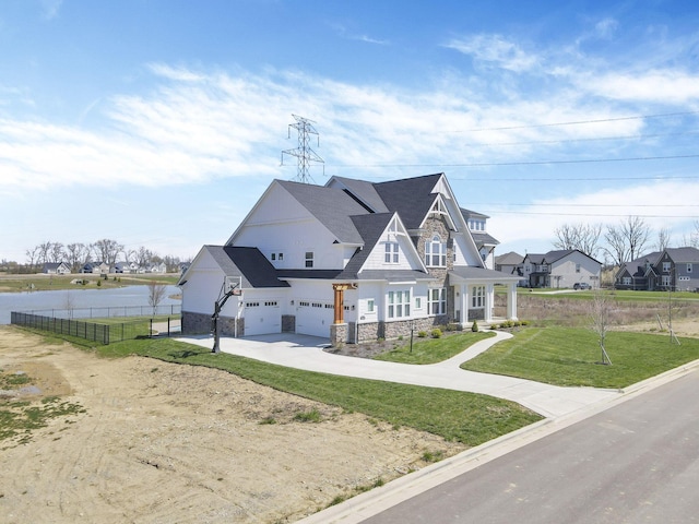 6764 Woodedge Ln, Hilliard, OH 43026 - view of front of home with driveway, stone siding, an attached garage, a front lawn, and fence