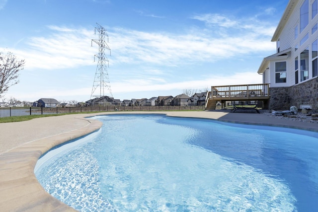 6764 Woodedge Ln, Hilliard, OH 43026 - view of pool with a fenced in pool, a wooden deck, and fence