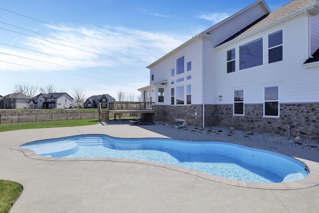 6764 Woodedge Ln, Hilliard, OH 43026 - view of pool featuring a deck, a patio area, fence, a fenced in pool, and a residential view