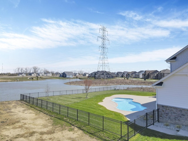 6764 Woodedge Ln, Hilliard, OH 43026 - view of swimming pool with a water view, a fenced backyard, a fenced in pool, and a lawn