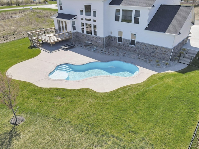 6764 Woodedge Ln, Hilliard, OH 43026 - view of pool featuring a patio area, fence, a wooden deck, and a yard