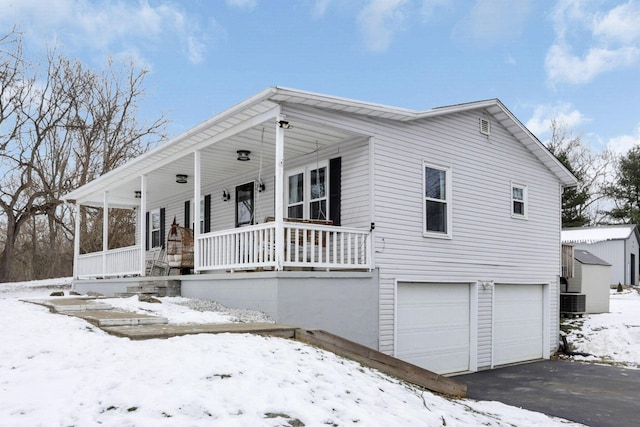 view of front facade featuring a porch and a garage