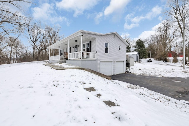 view of front of house with a garage and covered porch