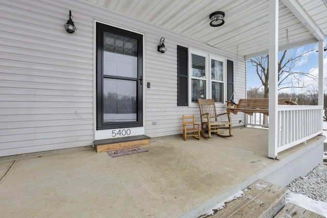 entrance to property with a porch