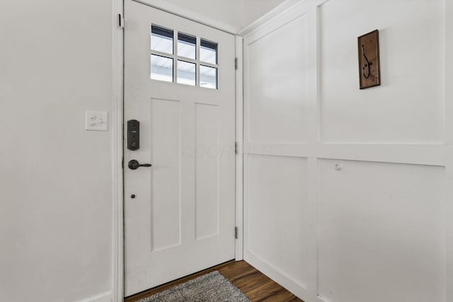 doorway to outside with dark wood-type flooring