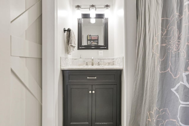 bathroom with vanity and curtained shower