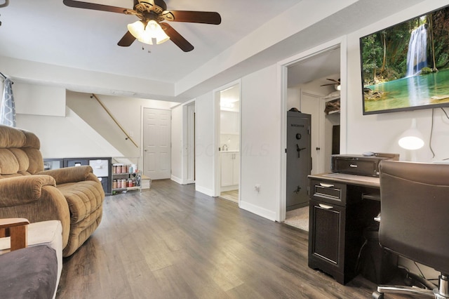 living room featuring dark hardwood / wood-style floors and ceiling fan