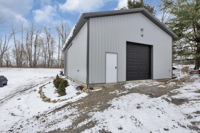 view of snow covered garage