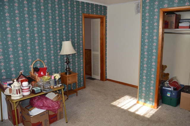 carpeted bedroom with ornamental molding