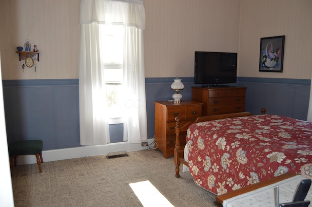 bedroom featuring carpet