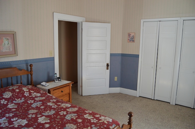 carpeted bedroom featuring a closet