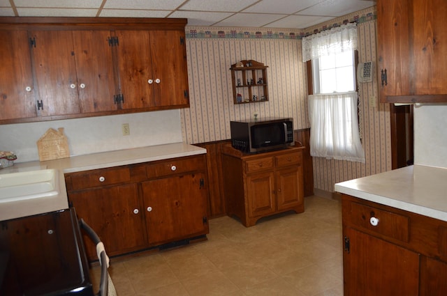 kitchen featuring stove and sink