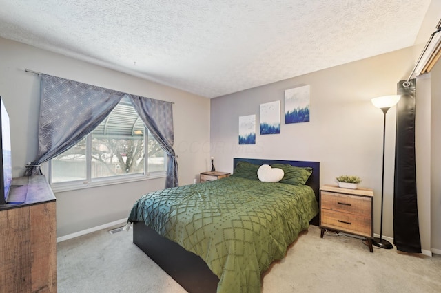 carpeted bedroom with a textured ceiling